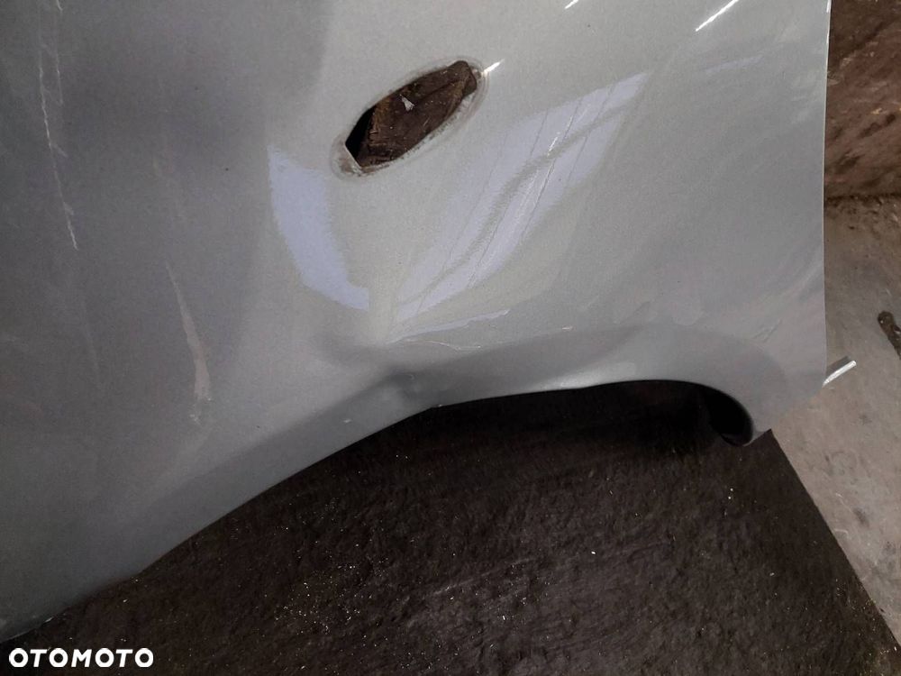 BŁOTNIK LEWY PRZÓD TOYOTA YARIS II LIFT 1F8 - 2