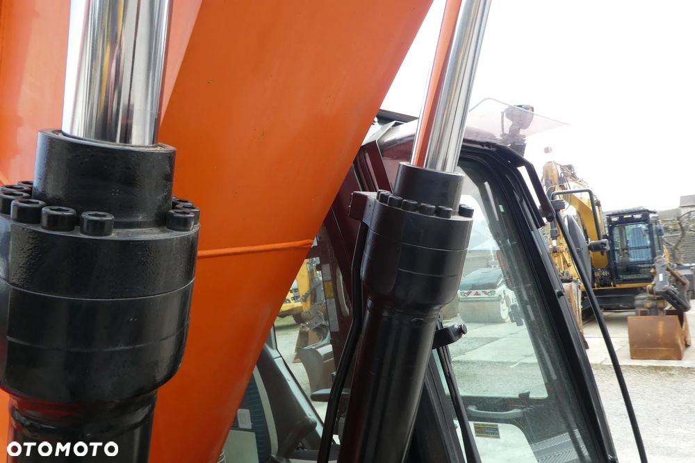 Caterpillar M 318F Z NIEMIEC TRZY ŁYŻKI - 28