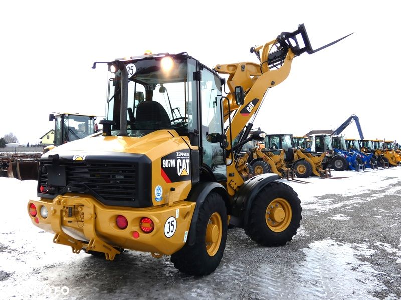 Caterpillar CAT 907M Z Niemiec / Wyjątkowo Wyposażony / 35km/h / 3.050mtg / - 40
