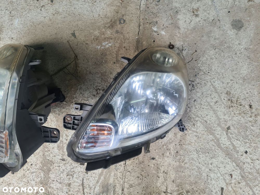 reflektor lampa lewa przód daihatsu sirion ii - 1