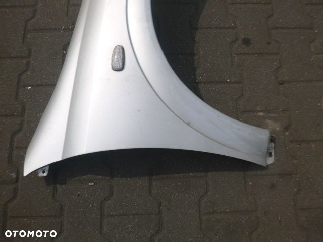 BŁOTNIK PRAWY PRZÓD PRAWY PRZEDNI OPEL ASTRA II G Z157 - 9