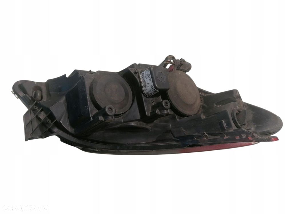 lampa lewa przednia przód opel astra iii h 93178635 1eg270370-21 - 4
