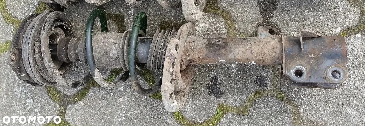 Micra K12 amortyzator przedni przód LEWY 1,5DCI Nissan - 1