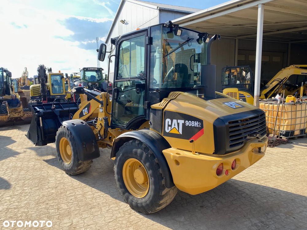 Caterpillar CAT 908H2, 2014 ROK, 6000 MTH, ŁYŻKA OTWIERANA + WIDŁY, z NIEMIEC, - 6