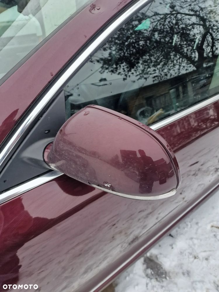 Lusterko  lewe  skoda  superb II  elektrycznie  składane 13 pinów  w kolorze  X7X7 - 1