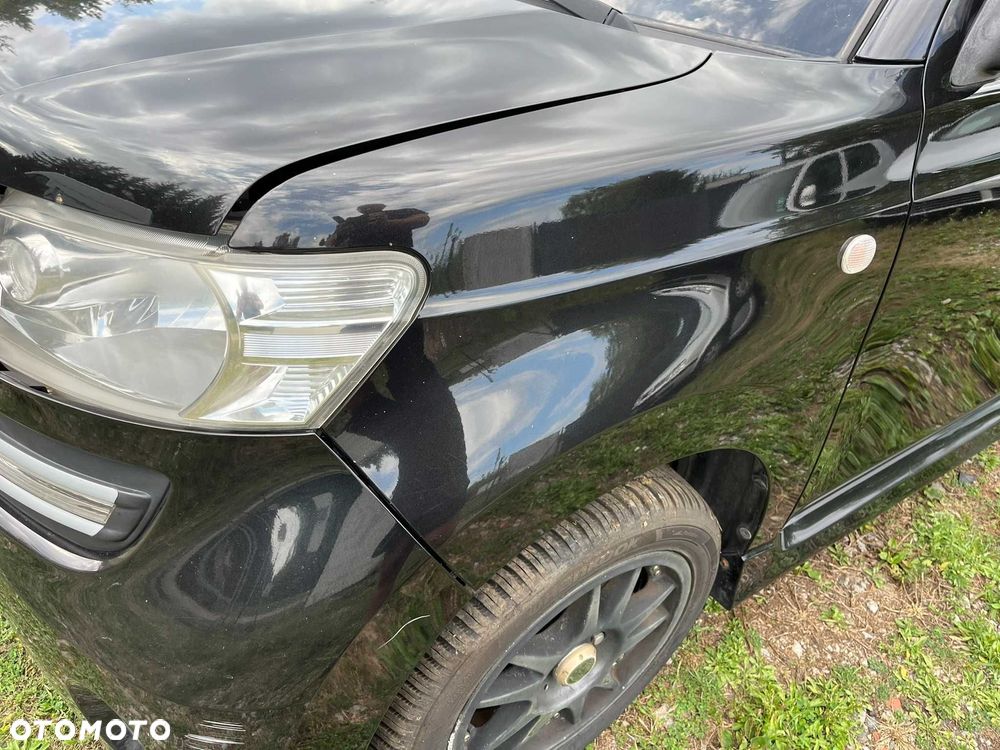 błotnik przód przedni lewy daihatsu materia x07 czarny 2006 - 2011 - 2