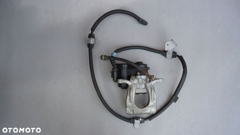 Zacisk hamulcowy lewy tył Qashqai J11 X-Trail T32