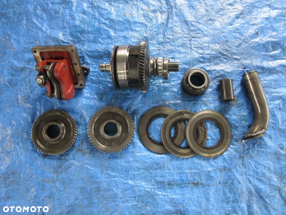 Wałek kosz tryb zębatka hamulec ręczny New Holland TM120 TM130 TM140 TM155 TM175 TM190