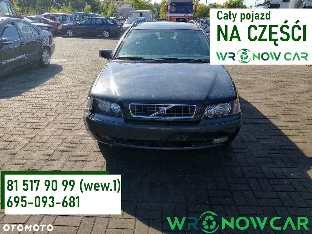 Volvo V40 I FL (99-04r.) 1.8 B 122KM. Silnik B4184S2 Skrzynia M5P lakier BLACK METALIC.Cały na części. GWARANCJA !!!  Przód Tył Zestaw Komplet Drzwi Klapa Zderzak Błotnik Maska Grill Atrapa Szyba Pas Lampa Lusterko Boczki Fotel Kanapa Kokpit Deska Rozdzielcza Przełącznik Włącznik Sterownik Przewody Wiązka Instalacja Moduł Komputer Czujnik Listwa Pompa Alternator Wtryski Głowica Rozrusznik Kompresor Sprzęgło Dwumas Silnik Skrzynia ABS Klimatyzacji Paliwa Wspomagania Kolektor Turbina Przepustnica Zawór Chłodnica Koło Hak Belka Sanki Zawieszenie Mcpherson Półoś Amortyzator Wydech Tłumik Zacisk Most - 1