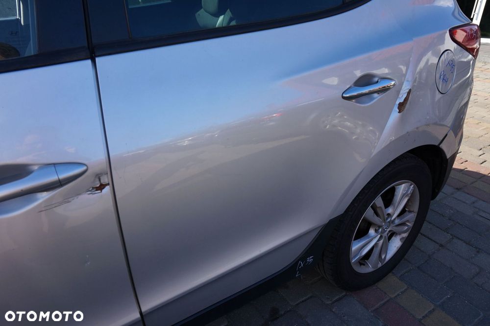 DRZWI TYLNE LEWE IX35 I  RAH  SREBRNY HYUNDAI 2009-2015 - 2