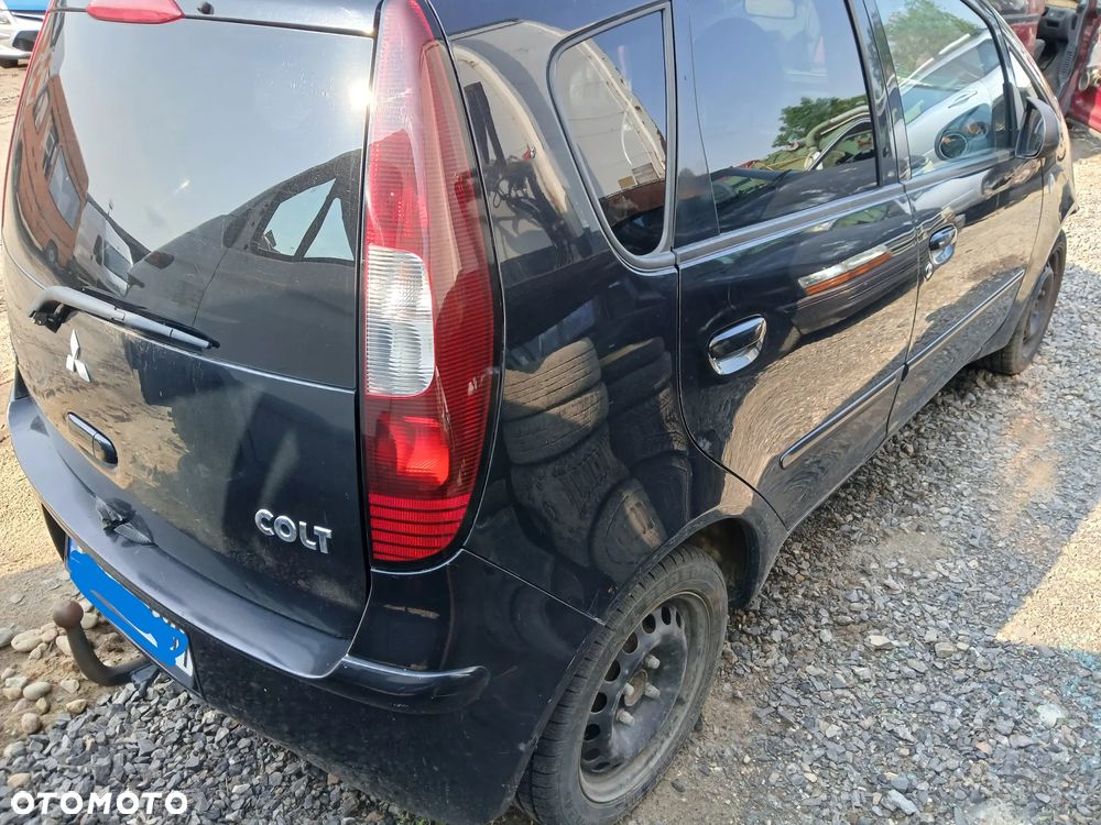 Mitsubishi Colt VI fotel fotele kanapa deska kokpit podsufitka boczek boczki klamka podłokietnik licznik - 2