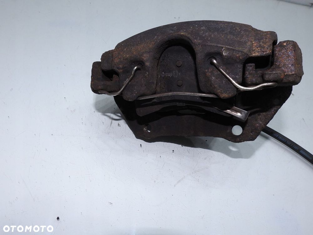 ZACISK HAMULCOWY LEWY PRZÓD OPEL MERIVA A - 2