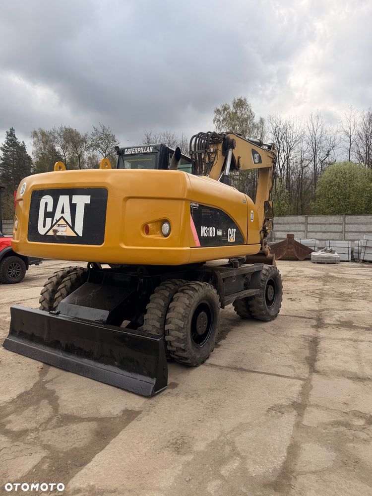 Caterpillar M318d - 12