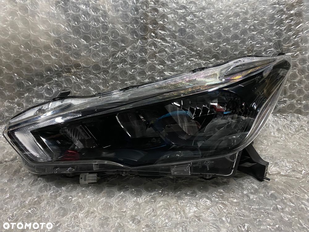 LAMPA LEWA ZWYKŁA CZARNA NISSAN MICRA K14 26060 5FA08 KOITO 100-18728 - 1
