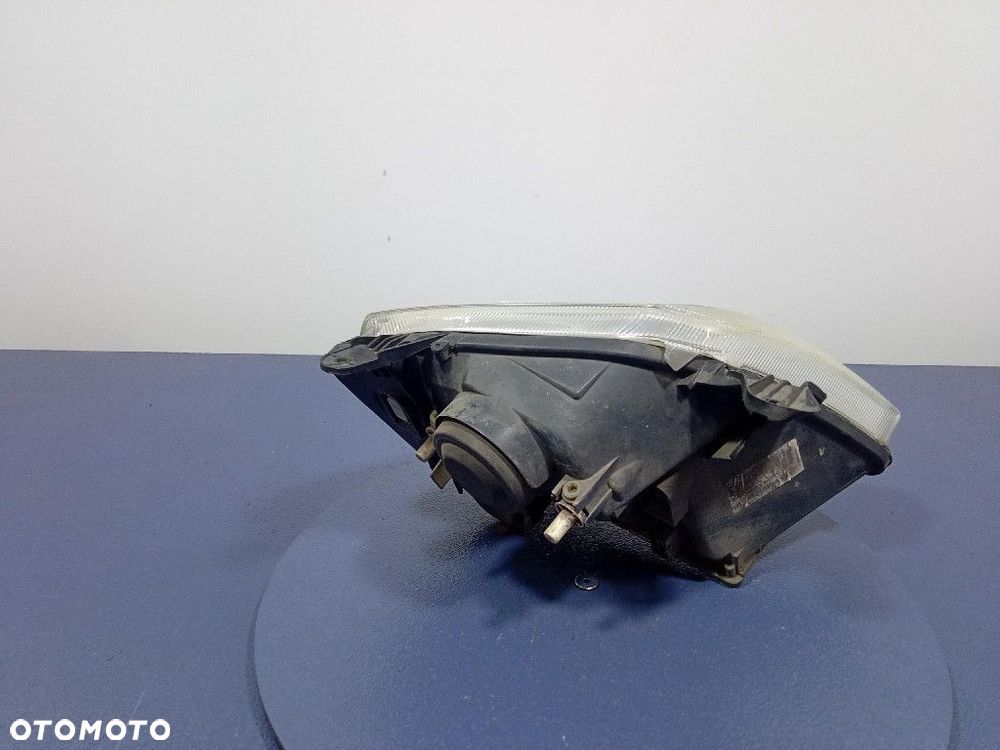 OPEL MERIVA I REFLEKTOR LEWY EU 89308550 - 2