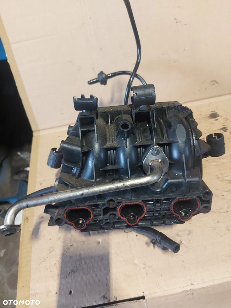 Kolektor ssący Opel Corsa C 1.0b '03r 09129713 - 5