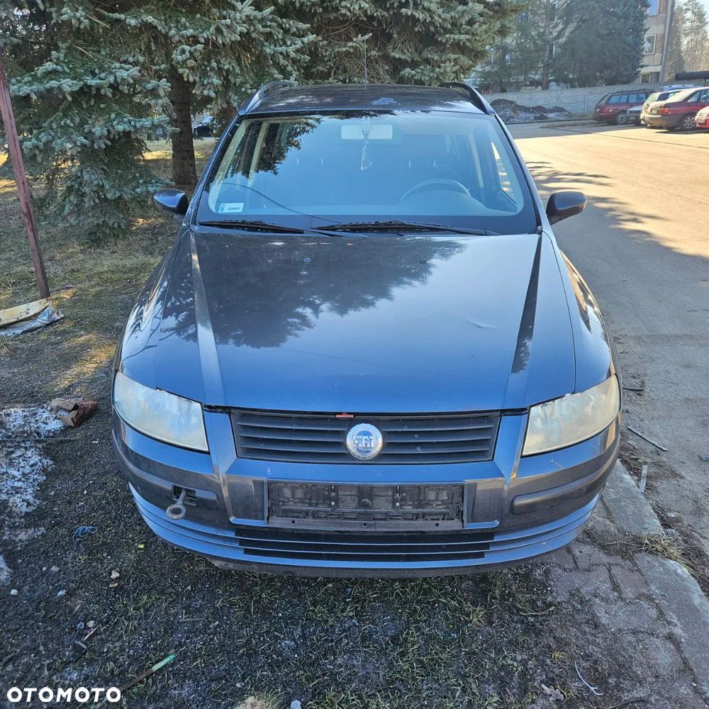 Fiat Stilo 1,6 B 76 kW / 103 KM (2003 kombi) (kod lak: 675) pojazd na części: maska, zderzak, drzwi, szyby, lusterka, chłodnica ... - 29
