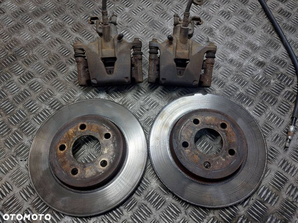 TARCZE HAMULCOWE TYŁ + KLOCKI + ZACISKI FORD MONDEO MK3 HB 5D - 2