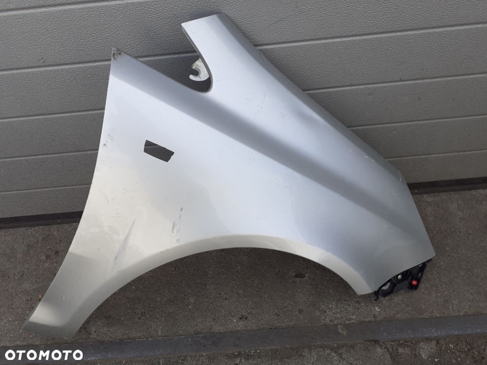 BŁOTNIK PRAWY PRZÓD OPEL CORSA D - 1