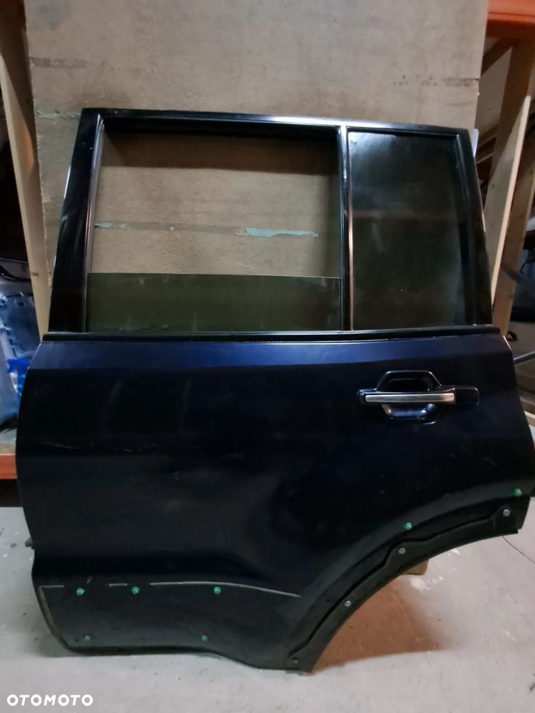 Drzwi Mitsubishi Pajero III 00-06' lewy tył (granatowe)