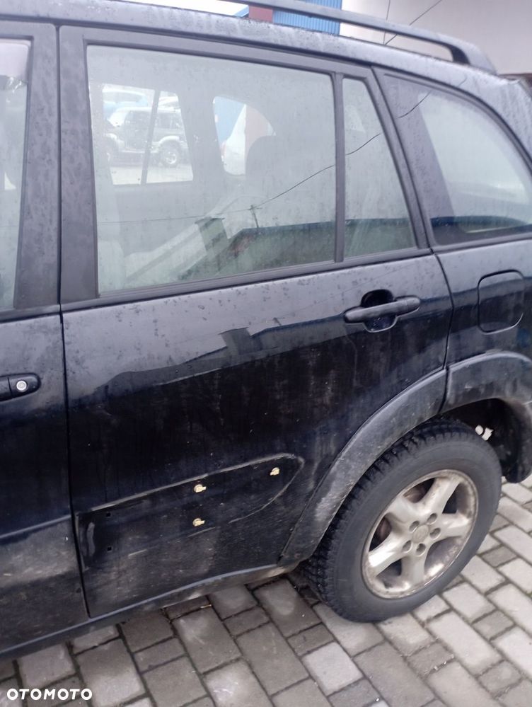 TOYOTA RAV4 II 5D DRZWI LEWE TYŁ TYLNE GOŁE 202 - 1