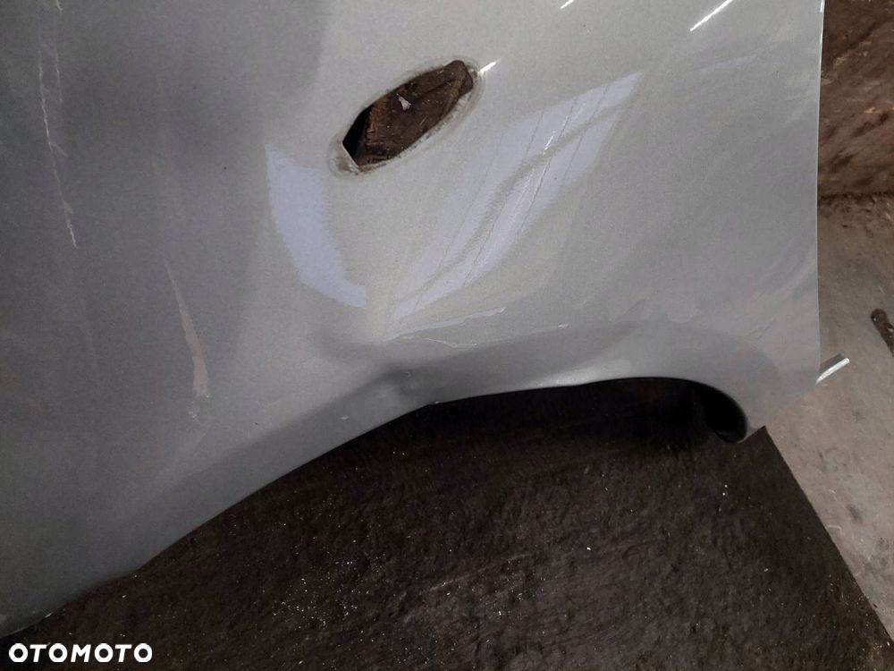 BŁOTNIK LEWY PRZÓD TOYOTA YARIS II LIFT 1F8 - 2