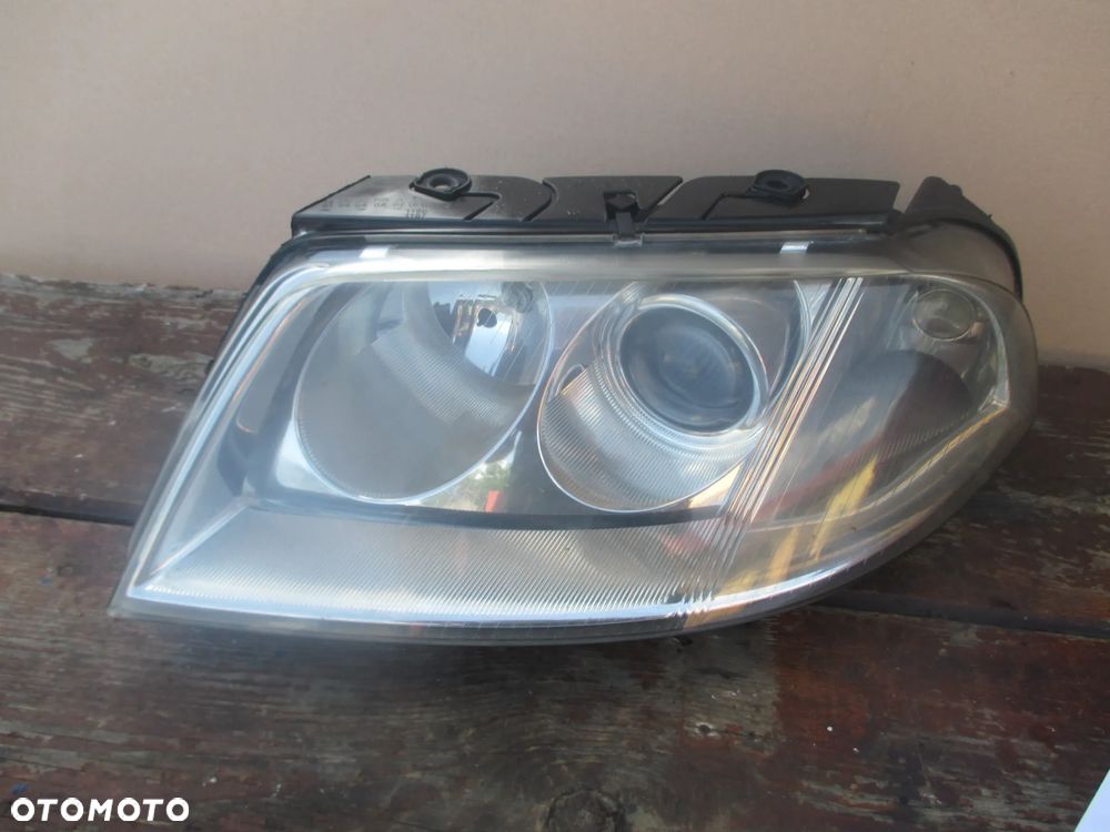 lampa lewa VW Passat B5 lift Hella Europa - 1