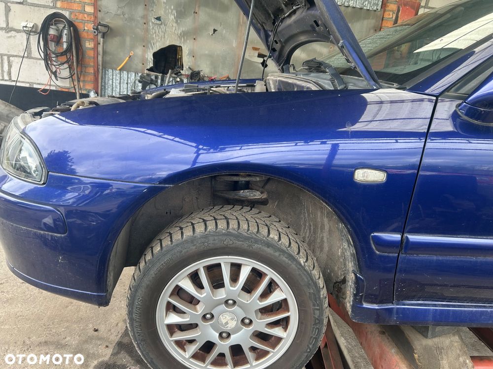 Błotnik lewy Mitsubishi Carisma lift T18