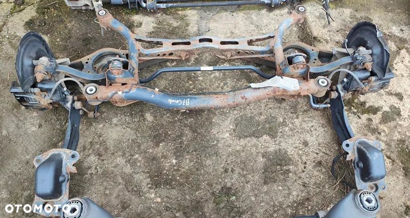 VW PASSAT B7 10r BELKA ZAWIESZENIA OŚ TYŁ TYLNA - 1