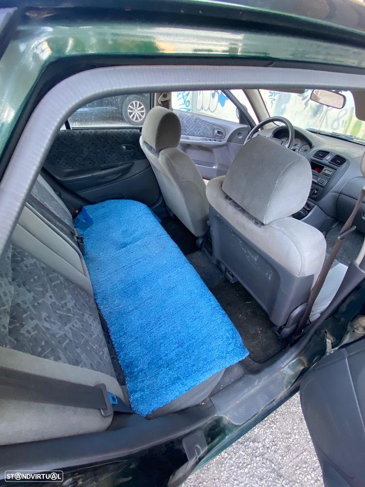 Mazda 323 1.3 - 7