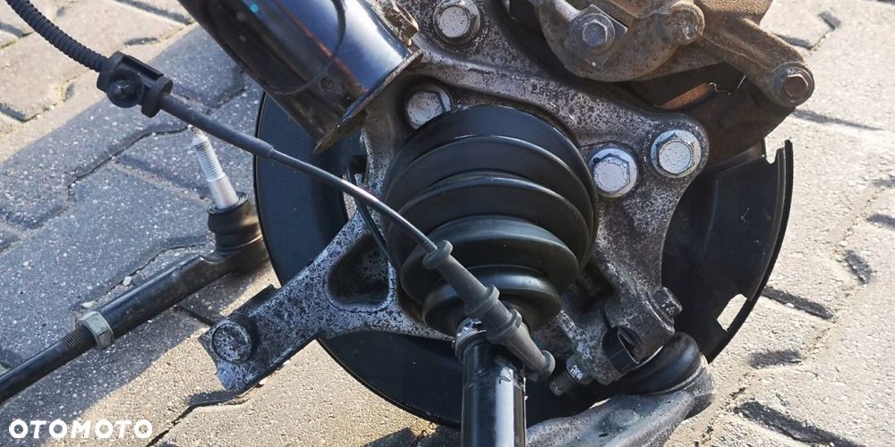 ZACISK WAHACZ LEWY PRZÓD OPEL ASTRA IV J 1.4i TB - 12