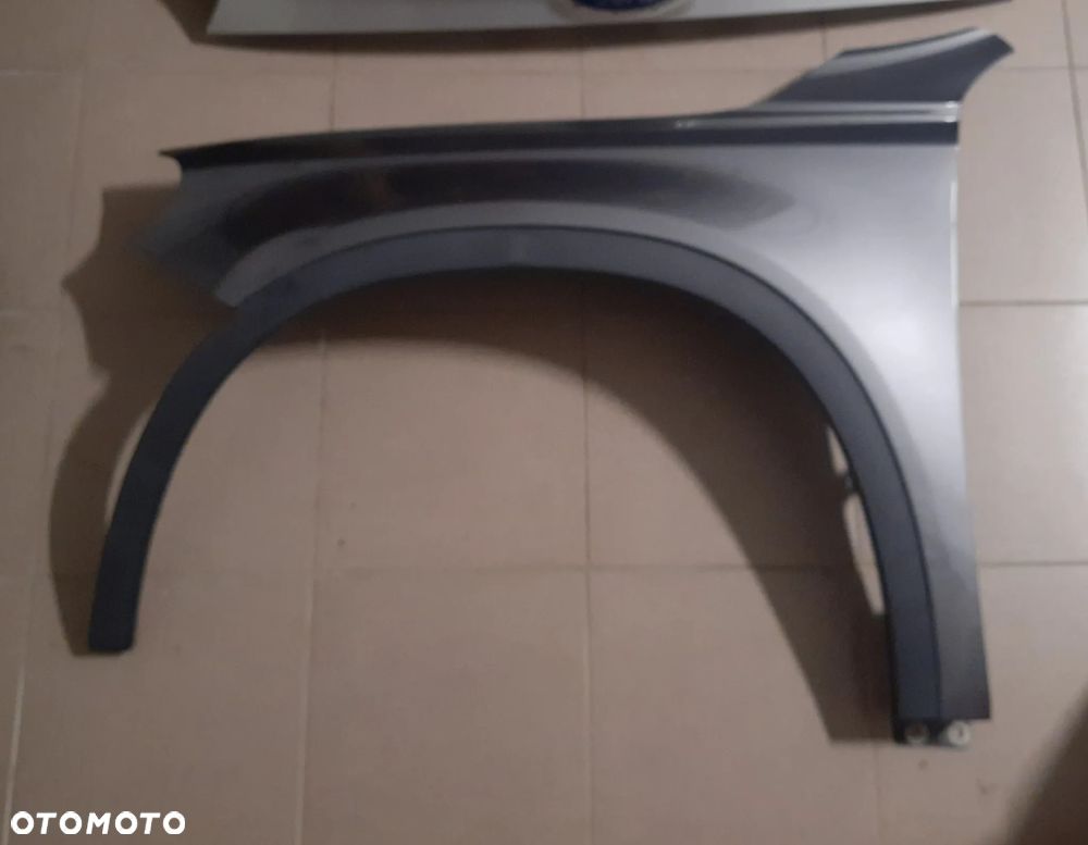 Maska pokrywa silnika skoda karoq nu7 kia sportage 5 v octavia 4 IV superb 4 fabia 4 2 IV karoq nu 7 57a toyota corolla e21 blotnik prawy przod audi a6 c8 lewy mercedes gla w156 a156 rq7 lampa przod panel led hyundai kona 2 II  tylna klapa bagaznika vw multivan t6 renault clio 4 kia ceed III 3 II 2 zderzak tyl skoda karoq przod toyota chr 2 II rav 4 rav4 5 - 24