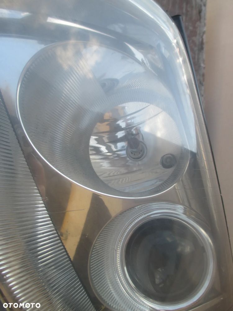 lampa lewa VW Passat B5 lift Hella Europa - 5