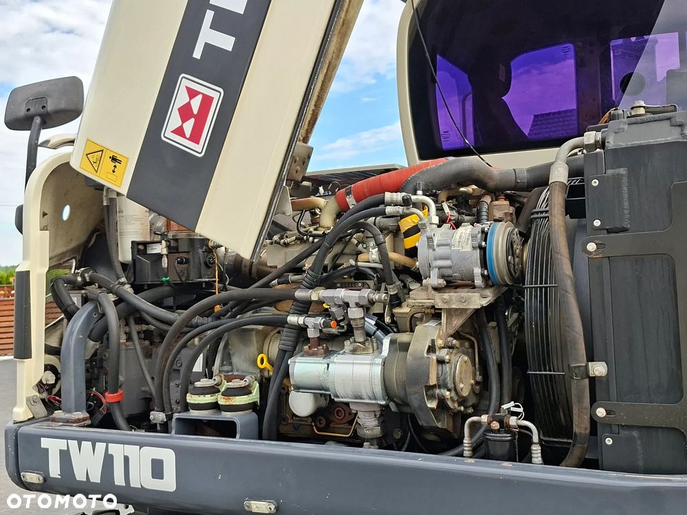 Terex SCHAEFF TW110 ROTOTILT ze szczypcami - 12