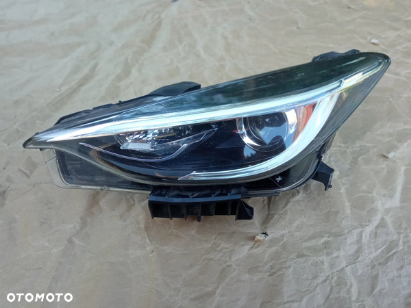INFINITI Q30 QX30 LAMPA REFLEKTOR LEWY SOCZEWKA LED ZWYKŁA 90070677 EUROPA 2017 ORYGINAŁ