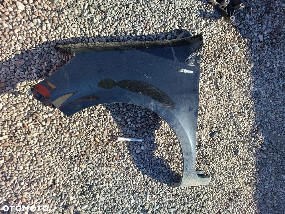 RENAULT CLIO 3 III LIFT 2012R CZARNY TEGNE BŁOTNIK PRZEDNI LEWY