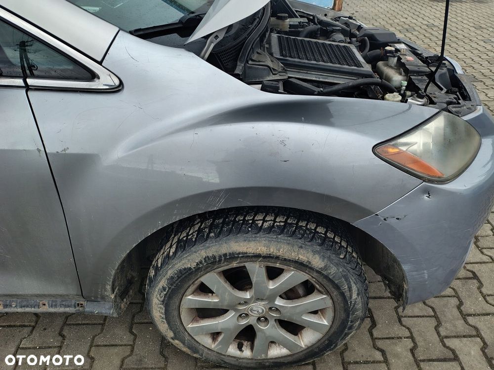 MAZDA CX7 BŁOTNIK PRAWY PRZÓD PRZEDNI - 1