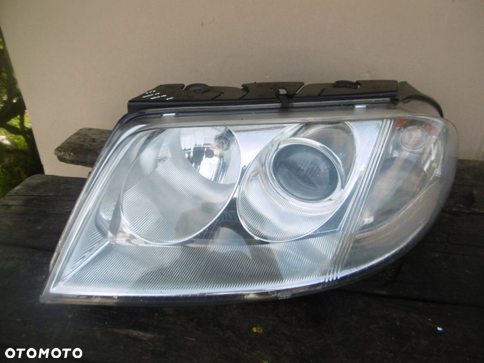 lampa lewa Passat B5 FL Hella Europa - 1
