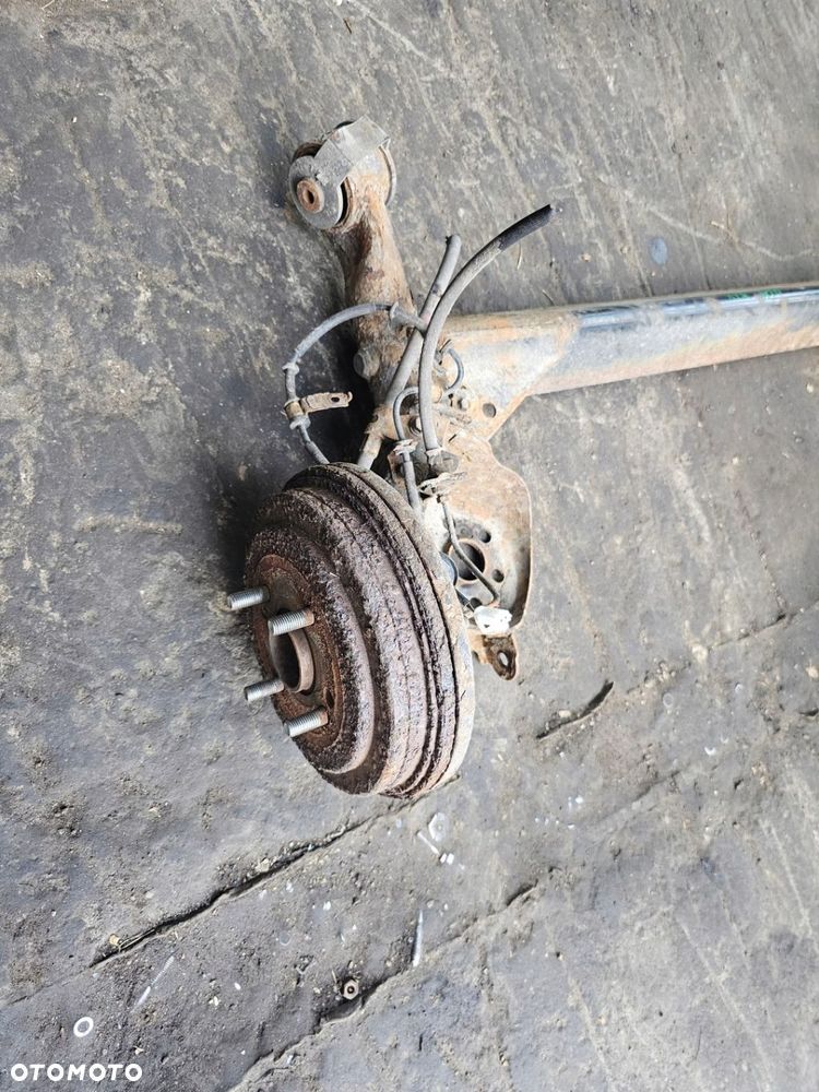 BELKA ZAWIESZENIA TYŁ BĘBNY KIA RIO II 09 1.4 16V SEDAN - 2