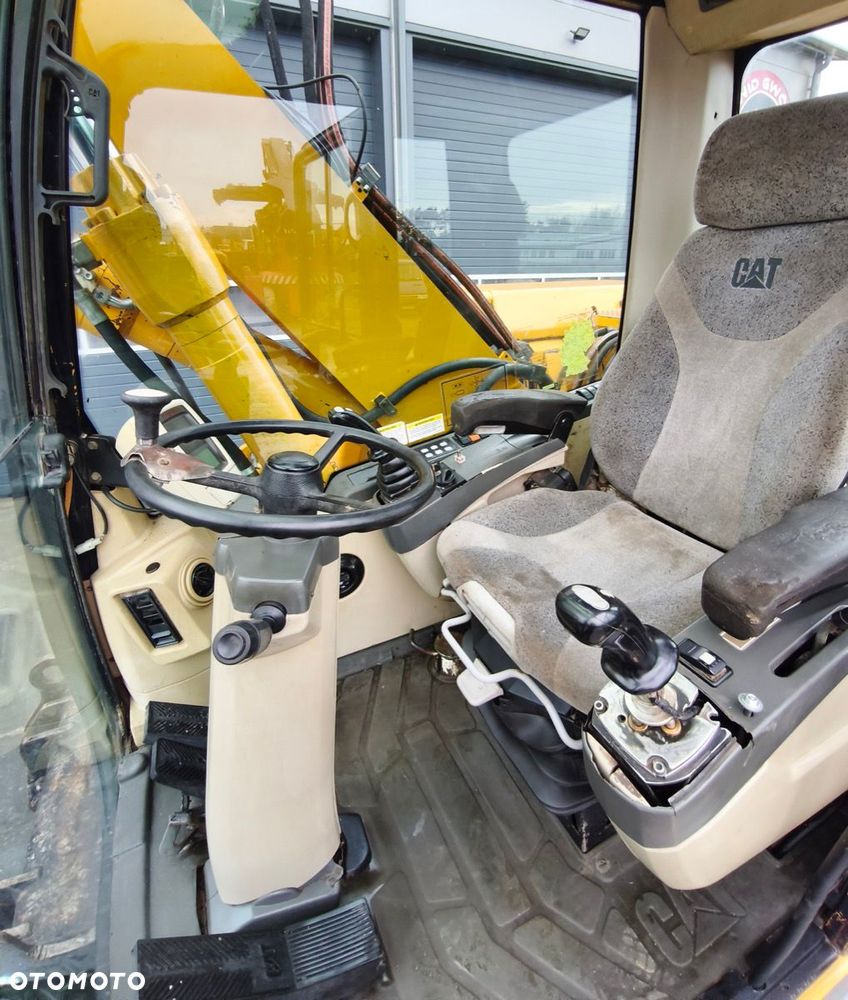 Caterpillar M316C - 12