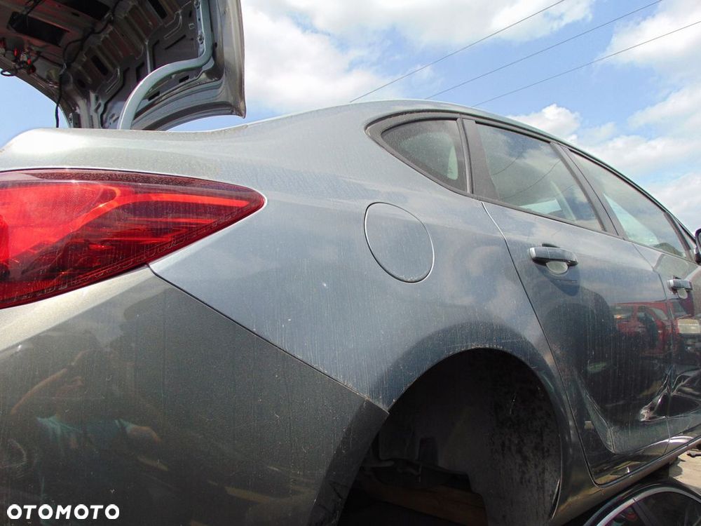 ĆWIARTKA BŁOTNIK PRAWY TYŁ OPEL ASTRA J 4 IV SEDAN - 1
