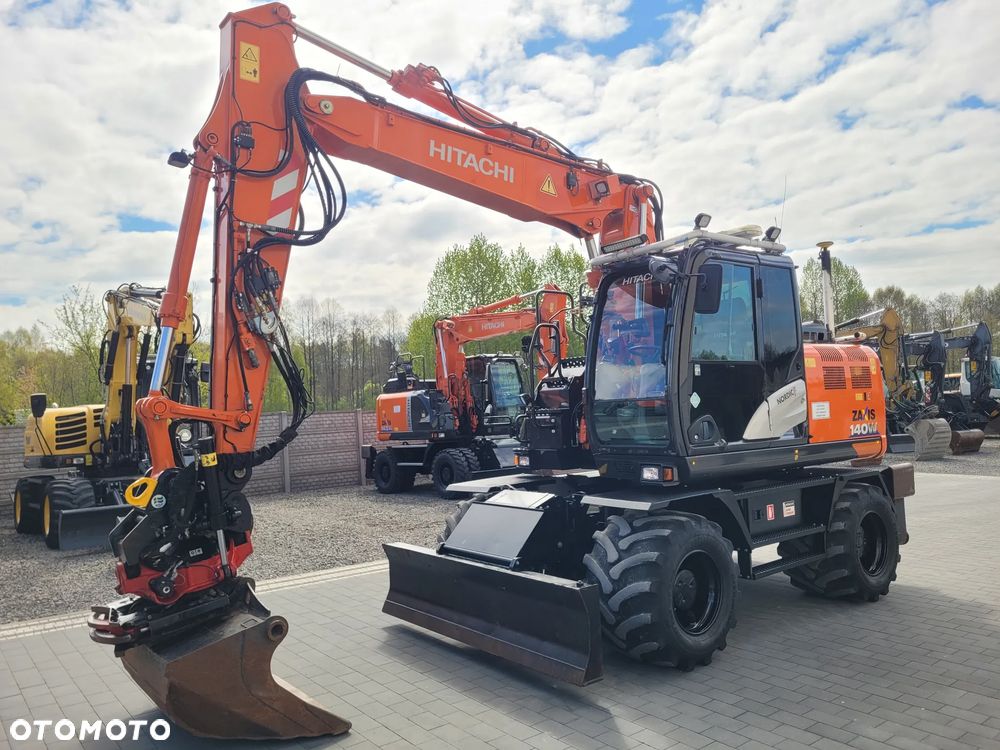 Hitachi ZX 140W / ROTOTILT ze szczypcami / system GPS 3D LEICA / - 3