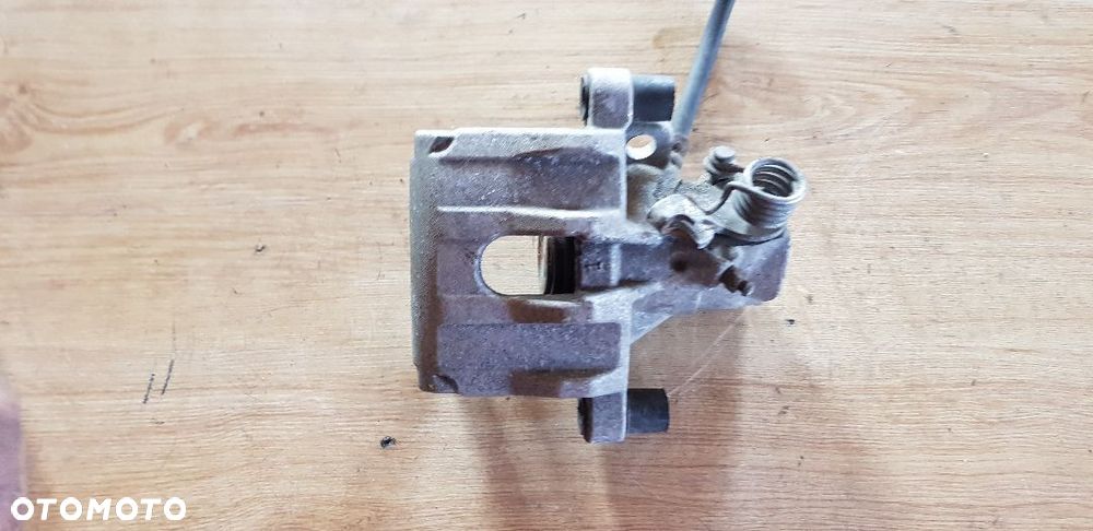 FORD FOCUS MK  II ZACISK HAMULCOWY LEWY TYŁ - 1