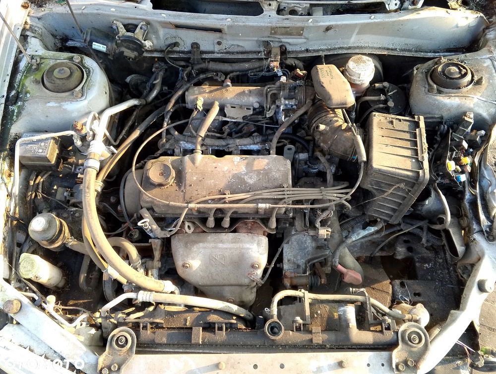 Mitsubishi Mirage CK2A Po Lift (99-03r.) 1.5 B 110KM. Silnik 4G15 Skrzynia F5M41 lakier A69 / A69A. Cały na części. GWARANCJA !!! Przód Tył Zestaw Komplet Drzwi Klapa Zderzak Błotnik Maska Grill Atrapa Szyba Pas Lampa Lusterko Boczki Fotel Kanapa Kokpit Deska Rozdzielcza Przełącznik Włącznik Sterownik Przewody Wiązka Instalacja Moduł Komputer Czujnik Listwa Pompa Alternator Wtryski Głowica Rozrusznik Kompresor Sprzęgło Dwumas Silnik Skrzynia ABS Klimatyzacji Paliwa Wspomagania Kolektor Turbina Przepustnica Zawór Chłodnica Koło Hak Belka Sanki Zawieszenie Mcpherson Półoś Amortyzator Wydech Tłumik Zacisk Most - 9