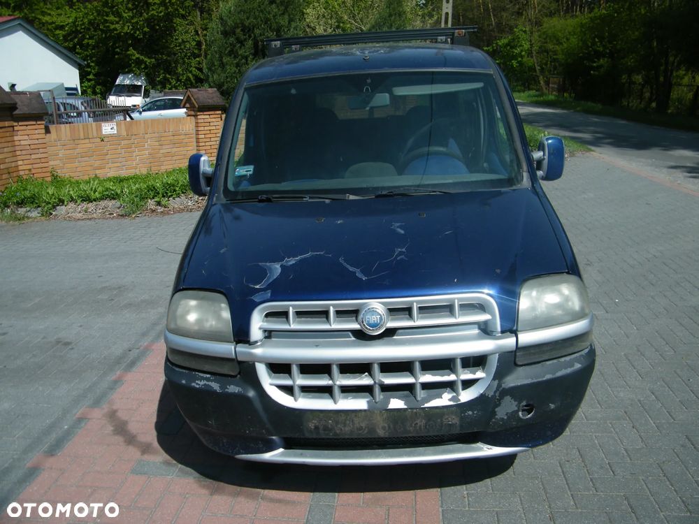 Fiat Doblo I (00-04r.) 1.9 JTD 100KM. Silnik 182B9000  (223ZXE1A) Skrzynia 55201066  (71723123; 55180658) lakier 480 BLUE VITALITY DERIN MAVI. Cały na części. GWARANCJA !!!  Przód Tył Zestaw Komplet Drzwi Klapa Zderzak Błotnik Maska Grill Atrapa Szyba Pas Lampa Lusterko Boczki Fotel Kanapa Kokpit Deska Rozdzielcza Przełącznik Włącznik Sterownik Przewody Wiązka Instalacja Moduł Komputer Czujnik Listwa Pompa Alternator Wtryski Głowica Rozrusznik Kompresor Sprzęgło Dwumas Silnik Skrzynia ABS Klimatyzacji Paliwa Wspomagania Kolektor Turbina Przepustnica Zawór Chłodnica Koło Hak Belka Sanki Zawieszenie Mcpherson Półoś Amortyzator Wydech Tłumik Zacisk Most - 2