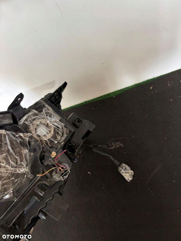 LAMPA LEWA REFLERTOR MITSUBISHI PAJERO SPORT L200 HALOGENOWA DEMONTAŻ EU - 12