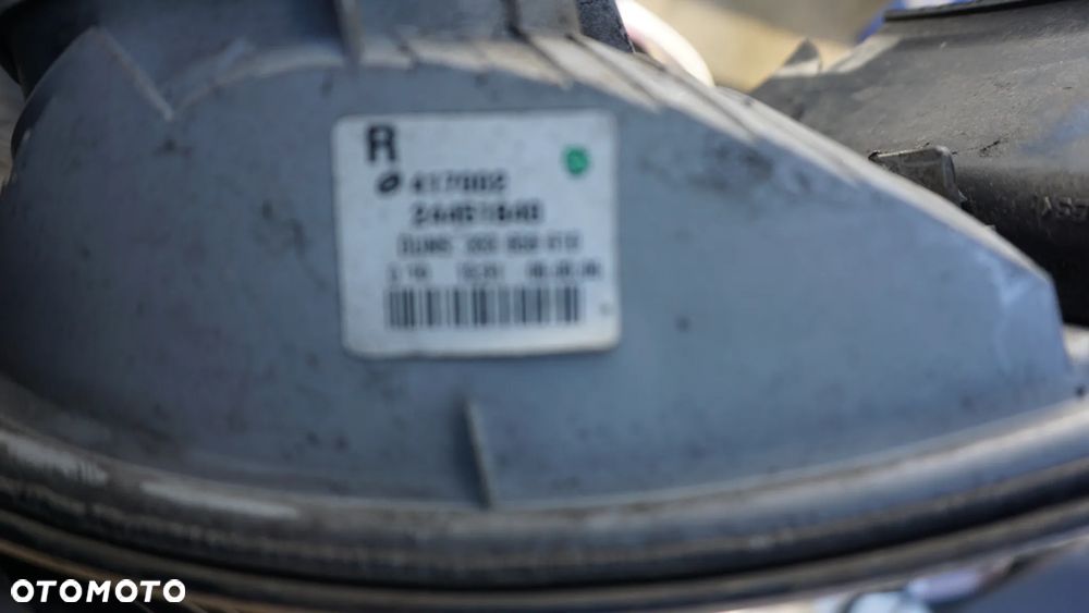 REFLEKTOR LAMPA ZBIORNIK PŁYNU SCHOWEK PASAŻERA ASTRA H - 7