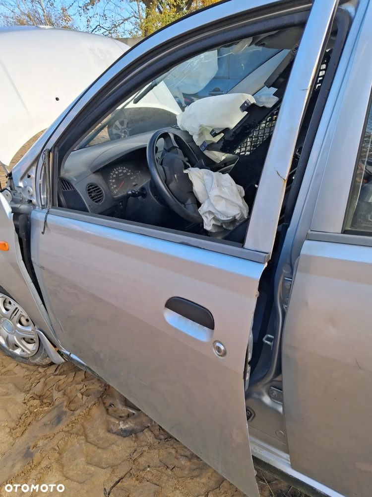 Daihatsu cuore 03 drzwi lewy przód E28 - 3