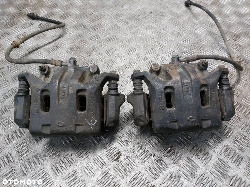TARCZE HAMULCOWE PRZÓD + ZACISKI RENAULT KOLEOS I 2.0 DCI - 7