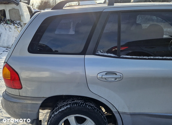 HYUNDAI SANTA FE I 00-06 BŁOTNIK PRAWY TYŁ  LL